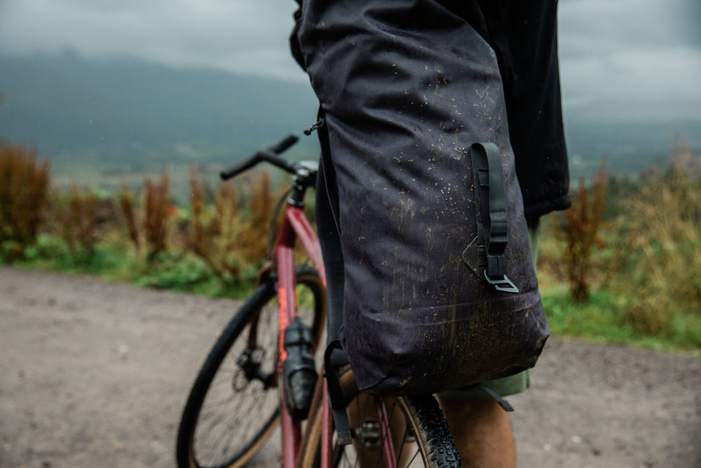 A muddy Smith the Roll Pack 18L